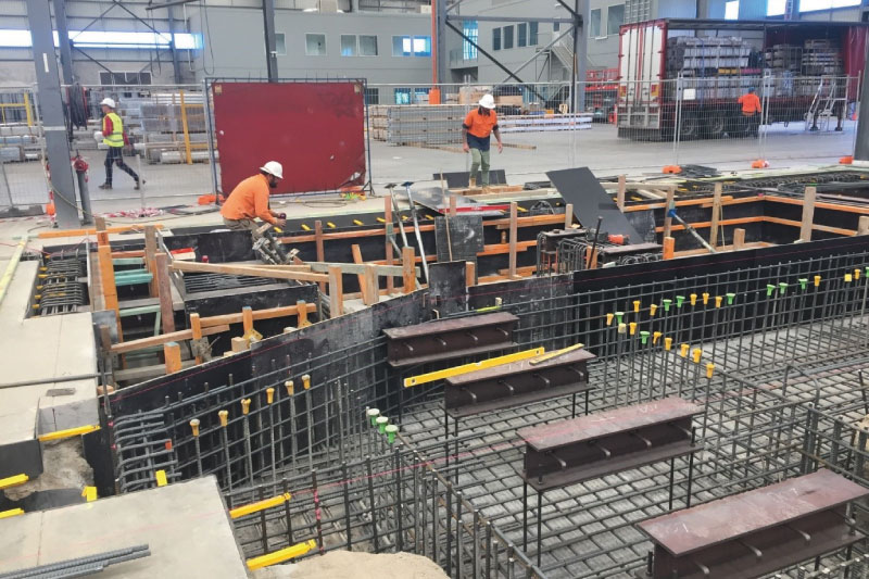 Men working on concrete formwork for complex concrete job